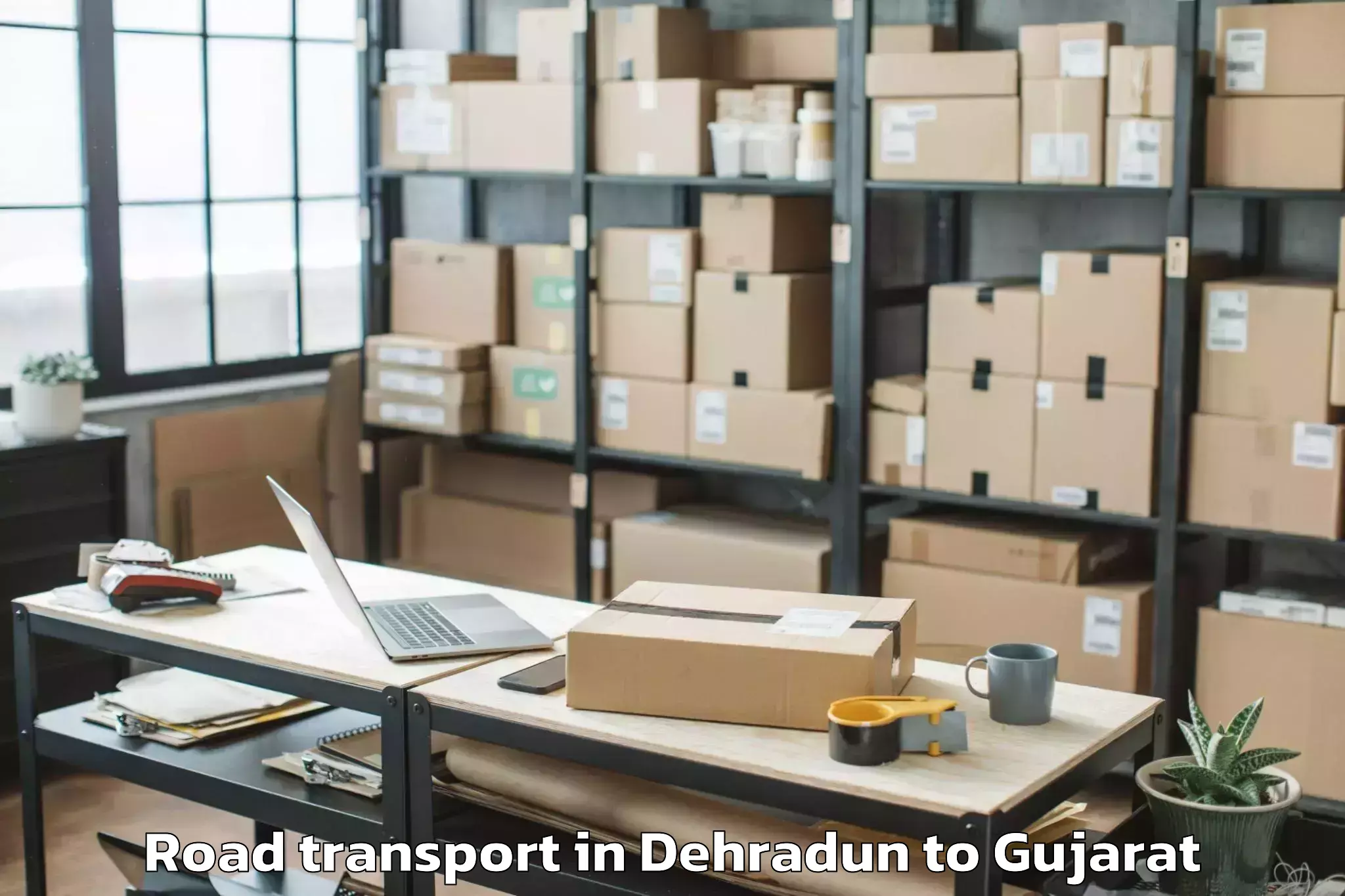 Book Dehradun to Gujarat Technological Universi Road Transport Online